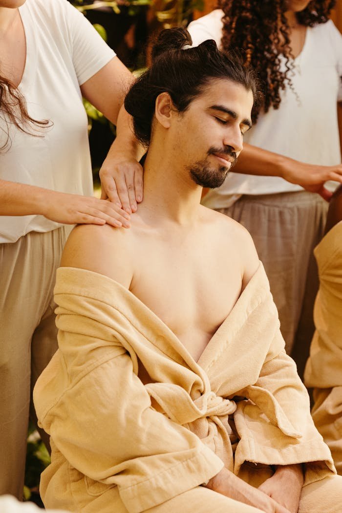 The Art of Drawing Readers In: Your attractive post title goes here A man enjoys a relaxing shoulder massage in a peaceful spa setting, promoting relaxation and wellness.
